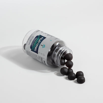 A bottle of NutriWell Solutions’ Mushroom Extract Gummies open with gummies pouring out. 